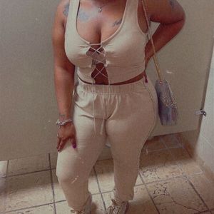 Large Tan set with Rhinestones  details. Worn once missing a few stones.